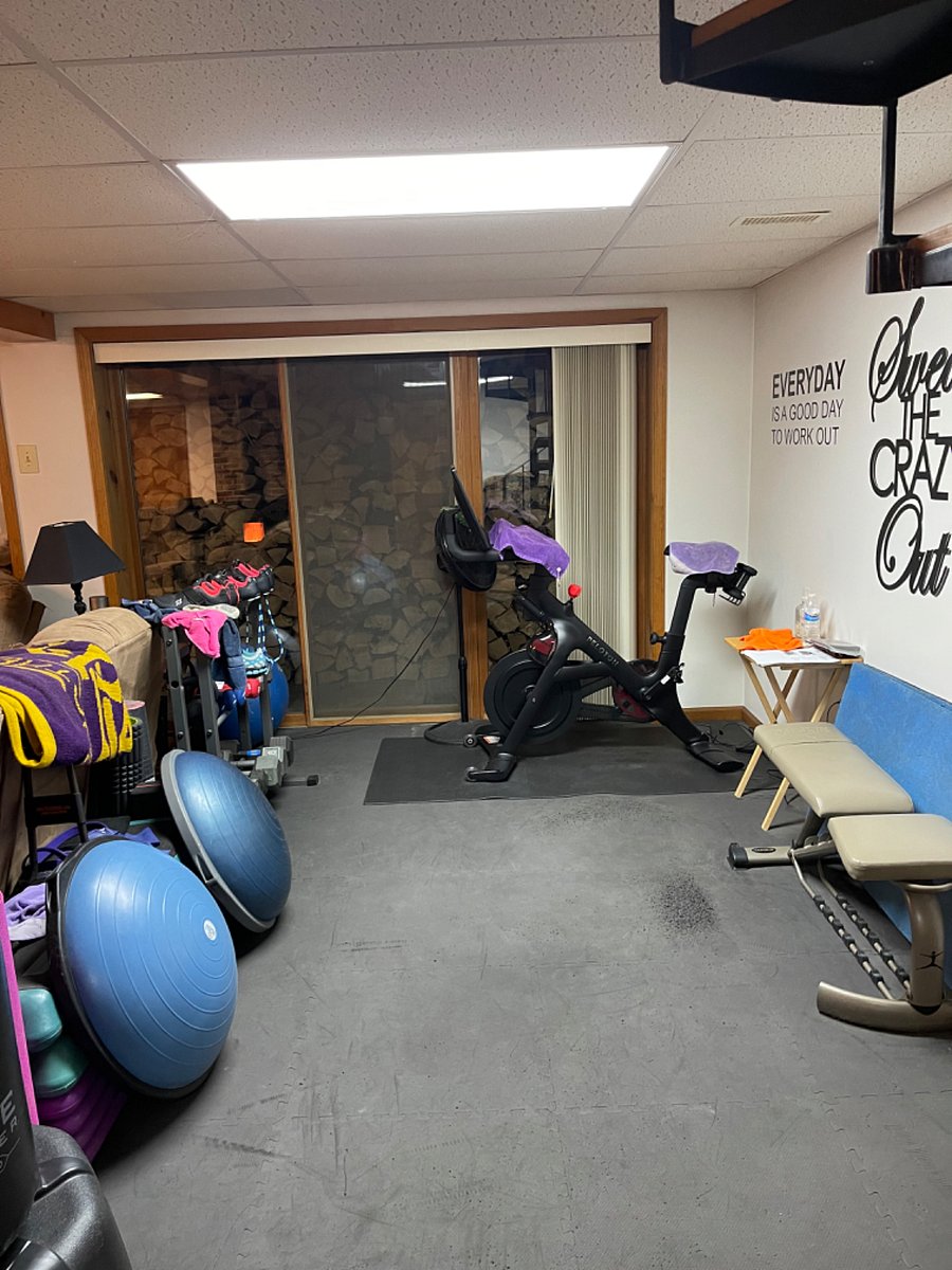 Work out area including Peloton bike