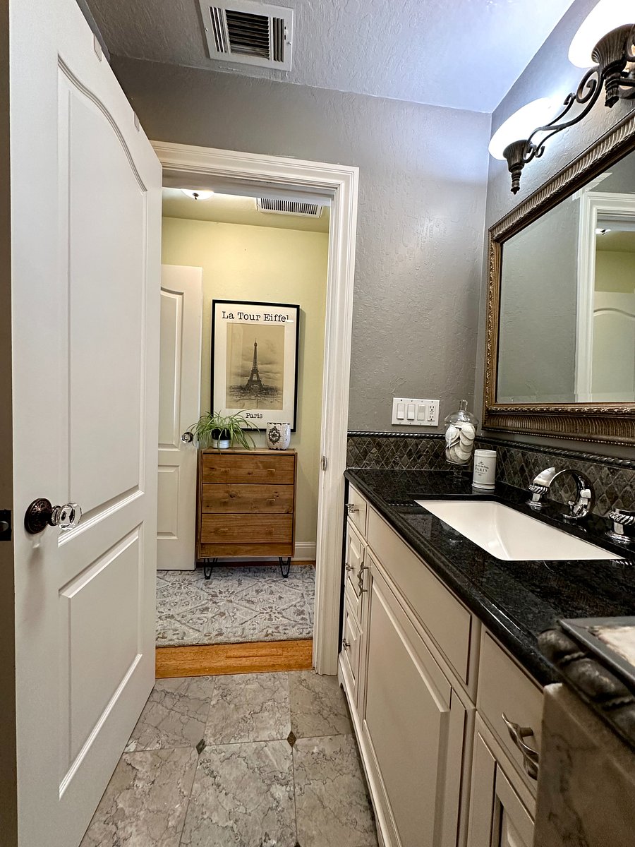 Granite countertops and ample storage for your toiletries. 