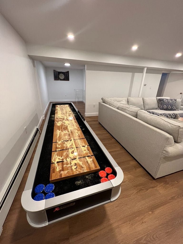 Shuffleboard table in basement