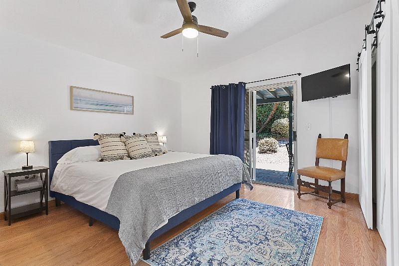 Brand new King size memory foam mattress with patio sliding doors to the backyard.