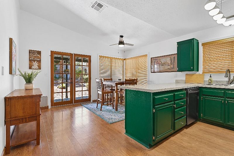 Open concept kitchen with patio doors to the enclosed yard.