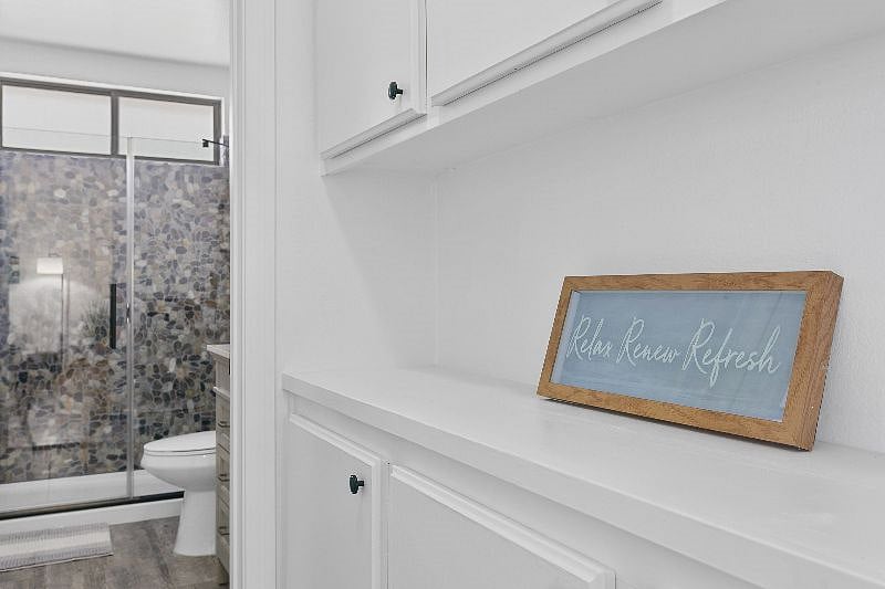 Large linen area with spare towels and linens. Lots of storage. 