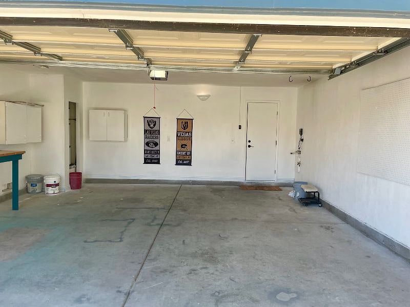 2 car garage with work bench and storage.