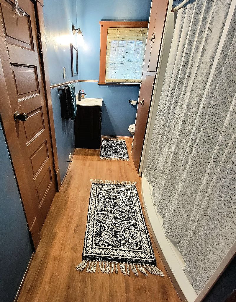 Bathroom: Vanity sink, toilet and shower