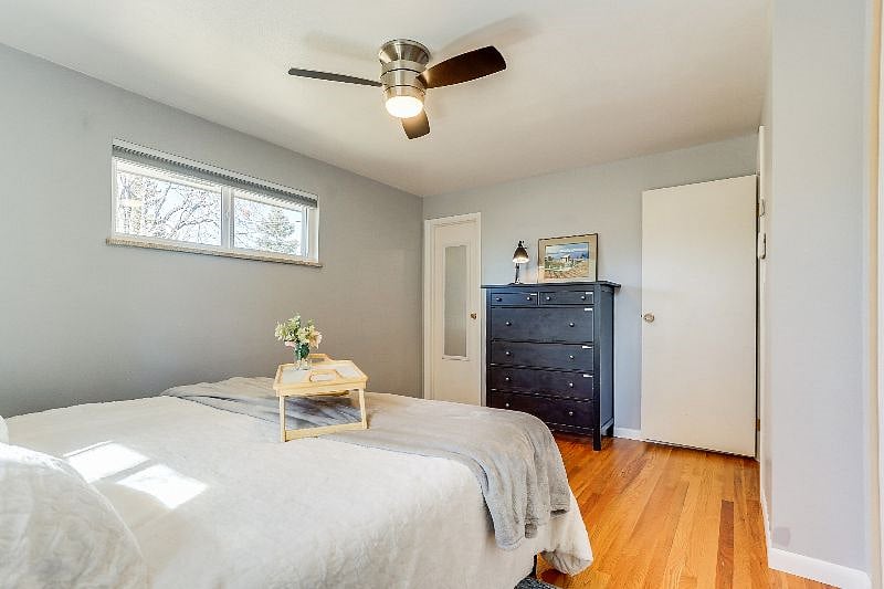 Main floor primary suite with king-sized bed and ensuite bathroom