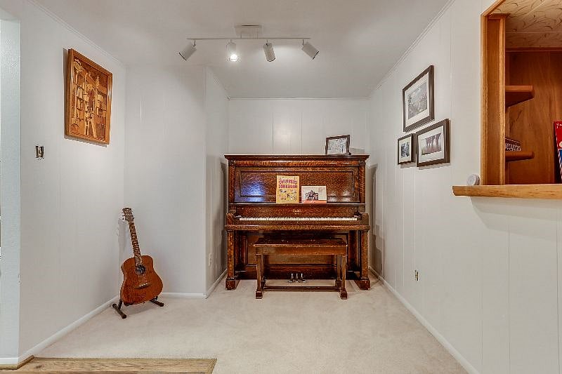 Basement landing area with piano