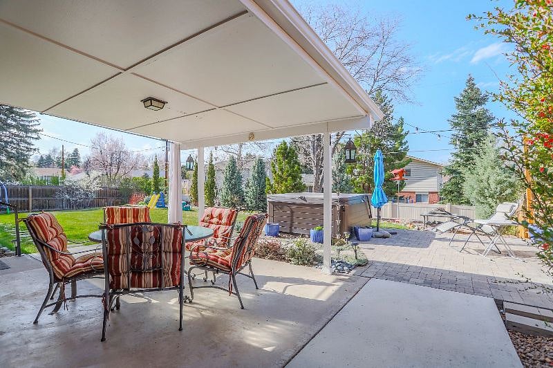 Large backyard and patio space, including covered patio and outdoor dining options