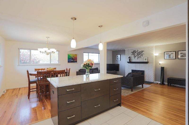 Large island, open floor plan for kitchen, dining space and main floor living room.