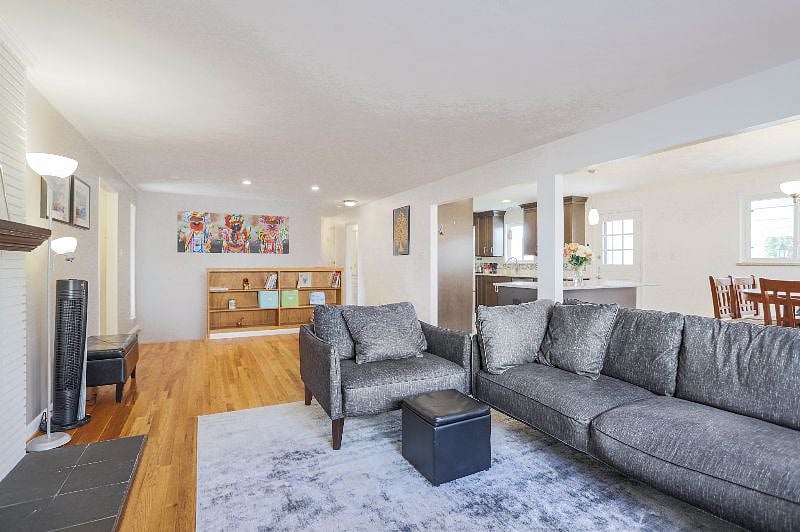Open floor plan with living room, dining and kitchen flowing together