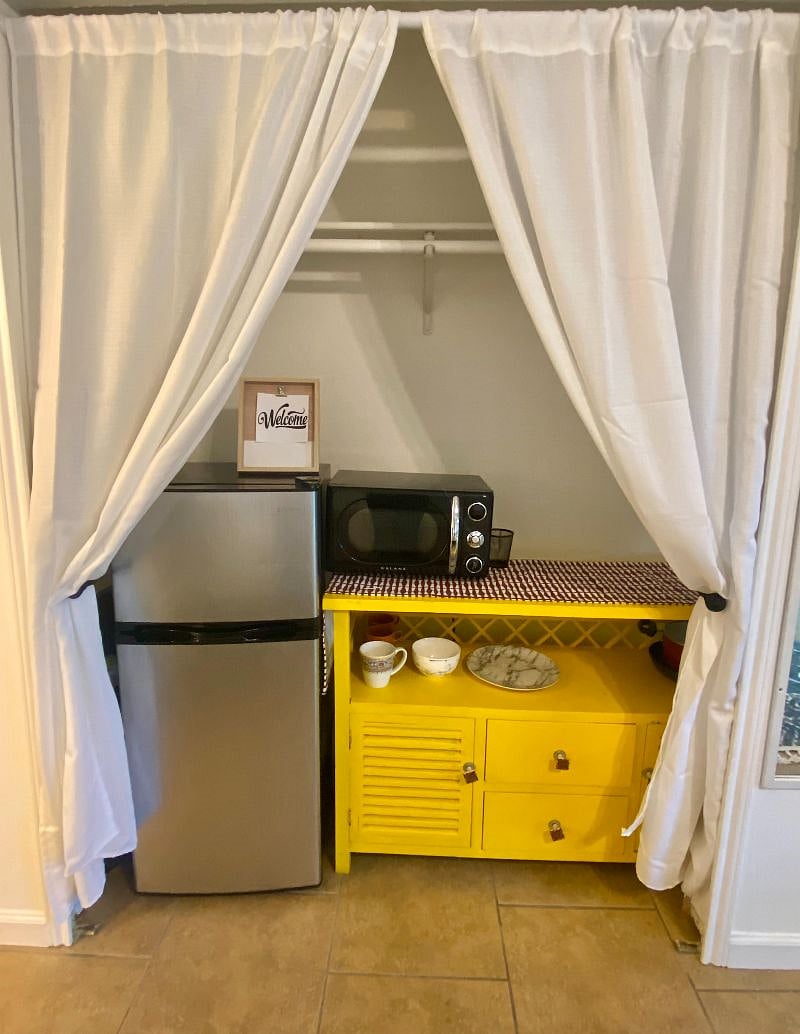 Kitchenette includes, fridge, microwave, air fryer, hot plate with pot/pans, Keurig, toaster, and dinnerware/cooking utensils