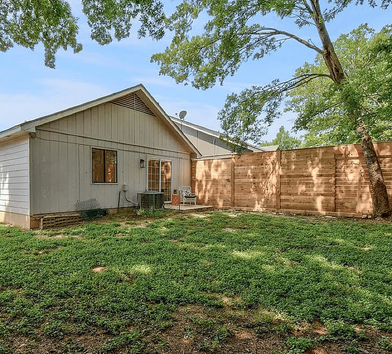 large and private fenced in backyard