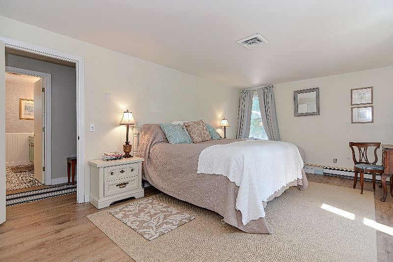 Primary BR w King Sized Bed and and Chaise LoungeKing