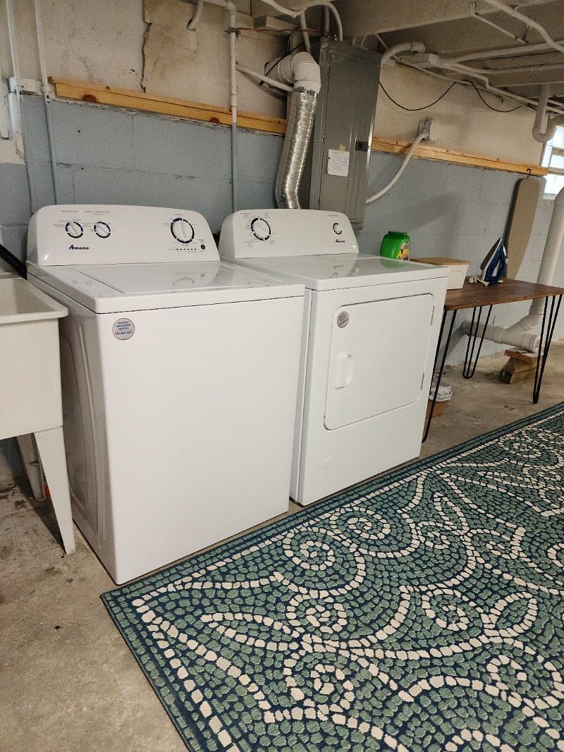 New washing machine and dryer in basement