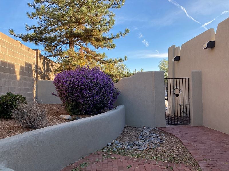 Front entry courtyard with outside gate.