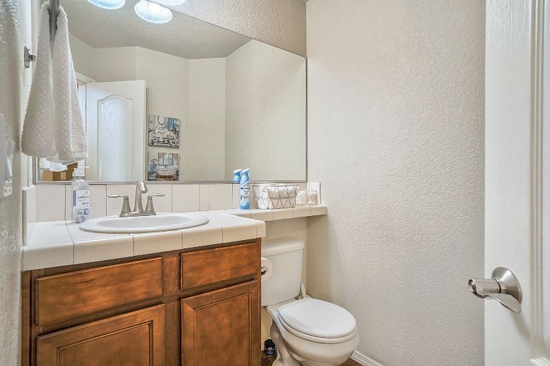 1/2 Bath is conveniently located off entry hall next to the main level Bedroom!