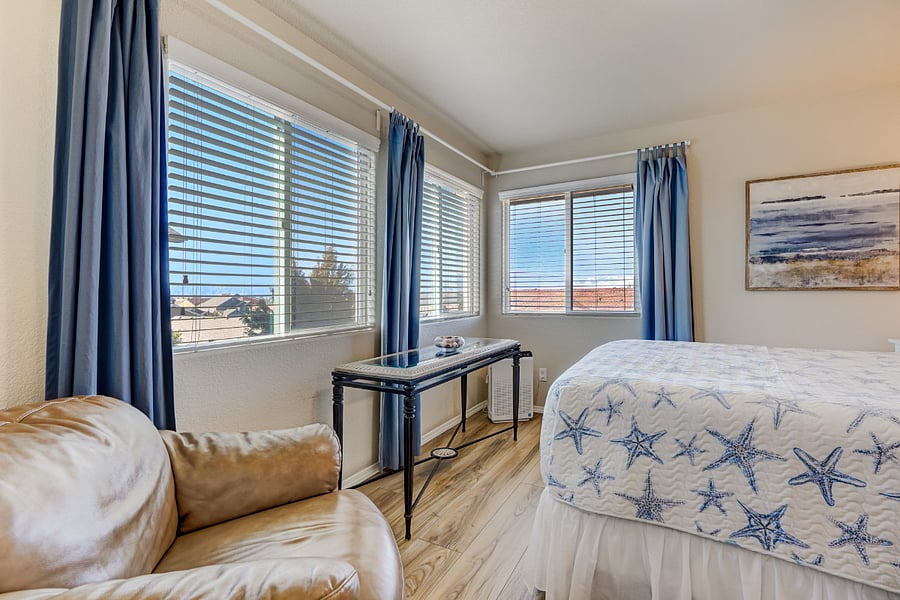 Sunlight floods the "Ocean" room enhancing the ocean theme & illuminating the space with a warm and natural glow. The interplay of light and color creates a serene and calming environment that echoes the peacefulness of coastal living!
