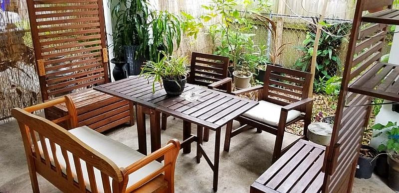 Carport Area. Furniture is moveable to park a car if desired.