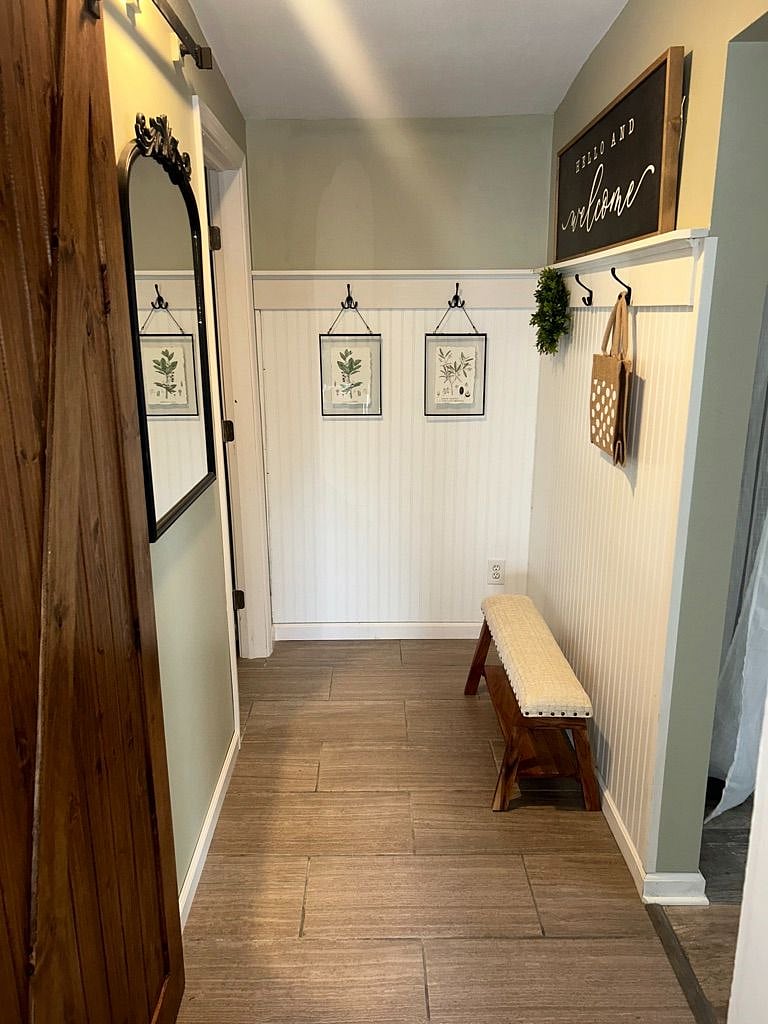 Hallway to Master Bedroom, washer & dryer on left behind sliding door