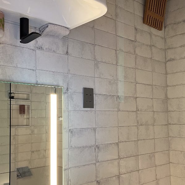 Tiled shower features radiant heating in shower and in the entire bathroom for super cozy comfort.