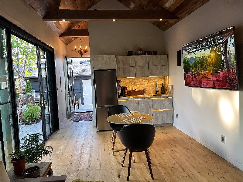 Oak flooring, stainless steel fridge, modern cabinetry, all lighting has dimmers, smart wall mounted flat screen TV.