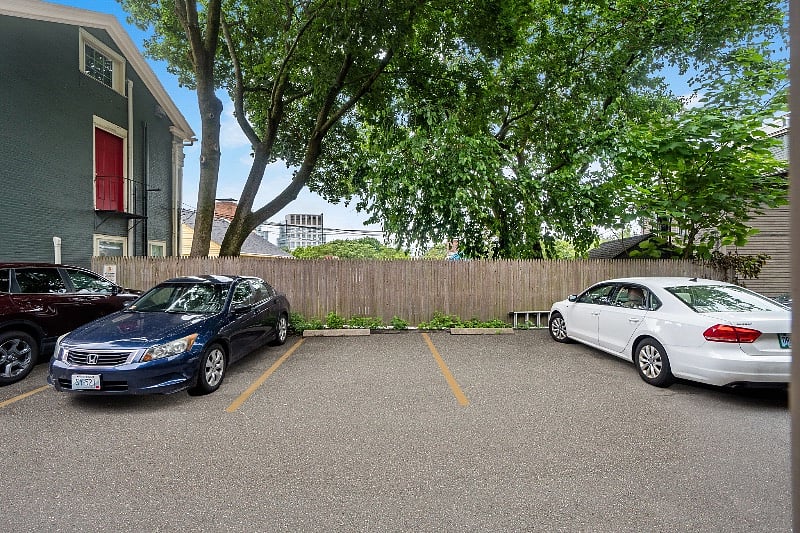 2 designated free parking spaces behind the building