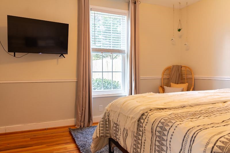 Master Bedroom with Smart TV and King Bed.