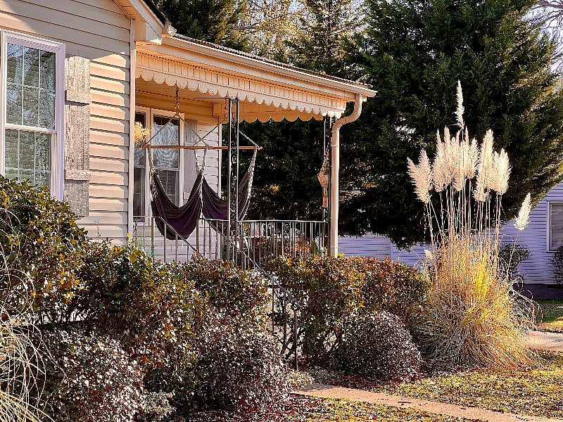 Swings welcome you on the front porch.