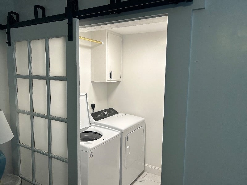 Barndoors hide the laundry room