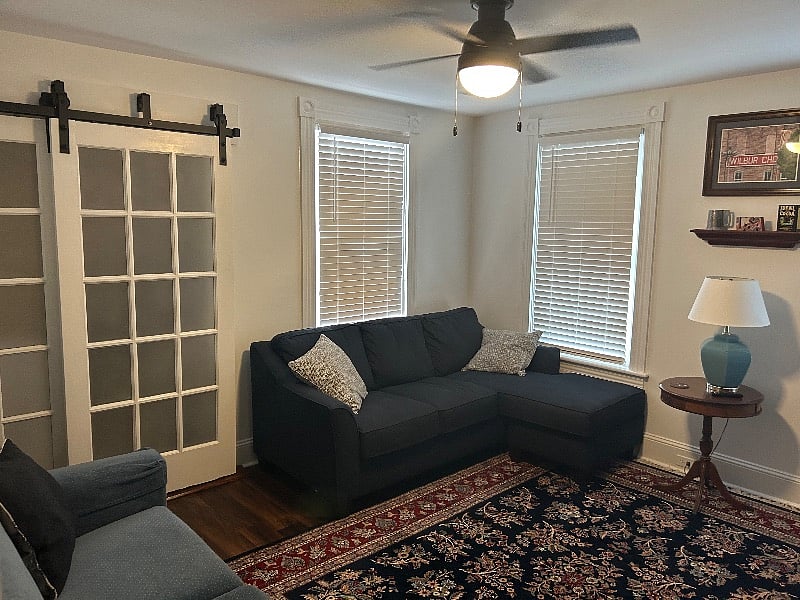 Living room with sectional and queen sofa bed