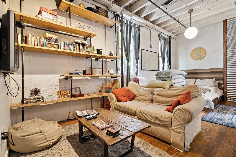 View of Sitting Area and Queen Bed Beyond