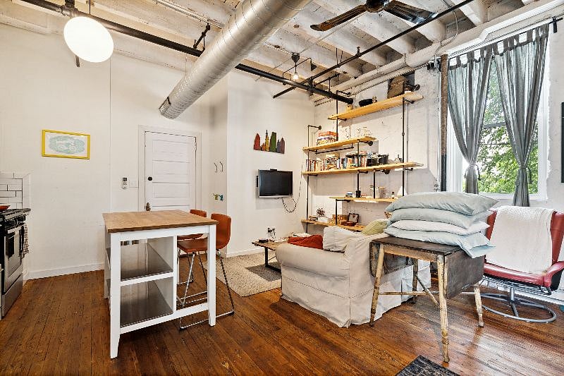 View of Kitchen Island and Couch with Television