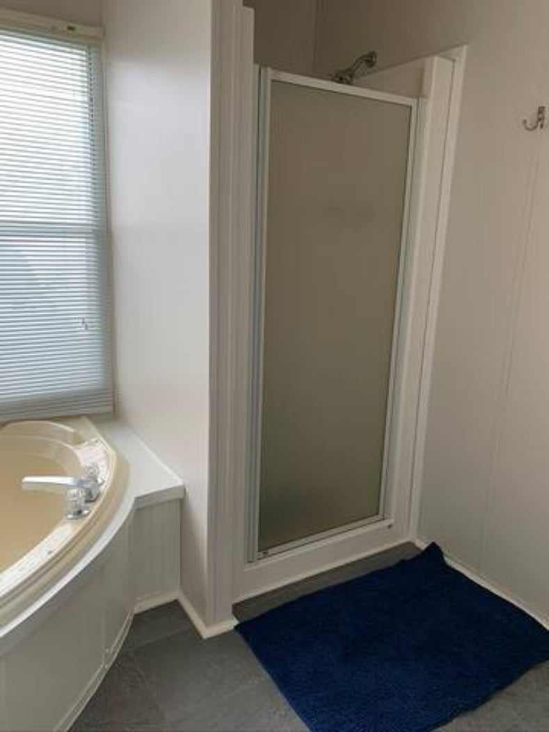 Ensuite bathroom off bedroom 1 with jacuzzi tub and shower