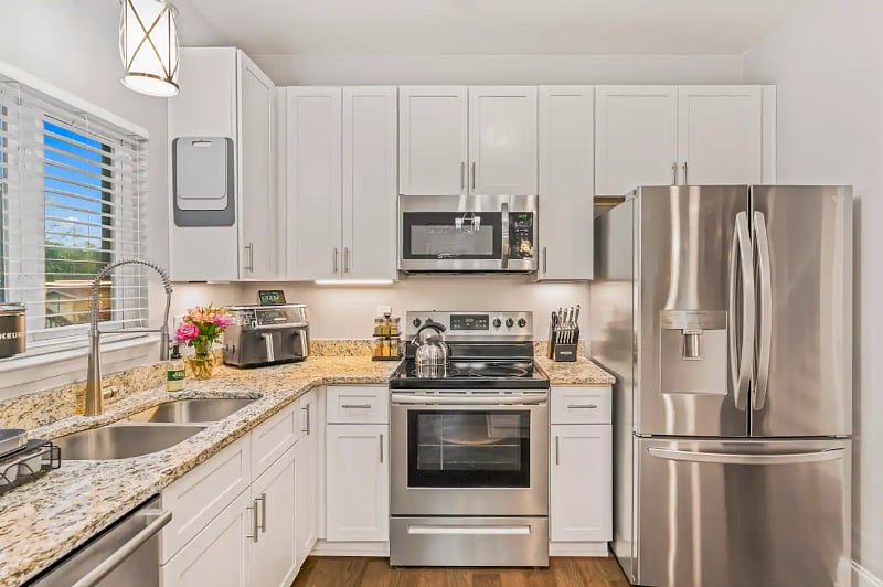 Kitchen equipped with fridge, stove, dishwasher, microwave, high end appliances such as Ninja Air fryer, Ninja Blender, Keurig Coffee Pot/Cup Maker, Spices and anything else you may need to make yourself at home. 