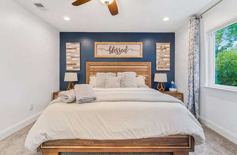 Master Bedroom equipped with 55" Smart TV, large walk in closet, a bathroom with shower, tub and his and her sinks. 