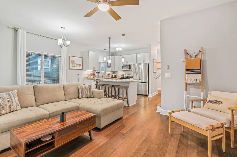 Living Room with lots of natural light, 75" smart TV, fireplace that can be used as a heat source or simply an ambiance. 