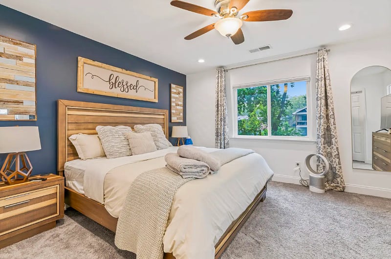 Master Bedroom equipped with 55" Smart TV, large walk in closet, a bathroom with shower, tub and his and her sinks. 