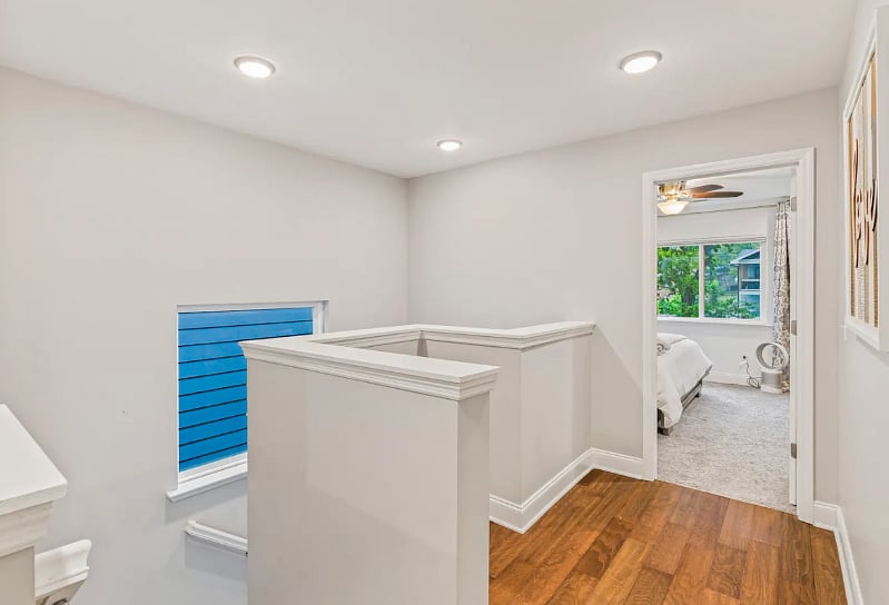 Upstairs Hallway. Second floor of home consists of Master bedroom with full bathroom, 2 Guest bedrooms with closets, a full bathroom, laundry, and an office with walk in closet.  