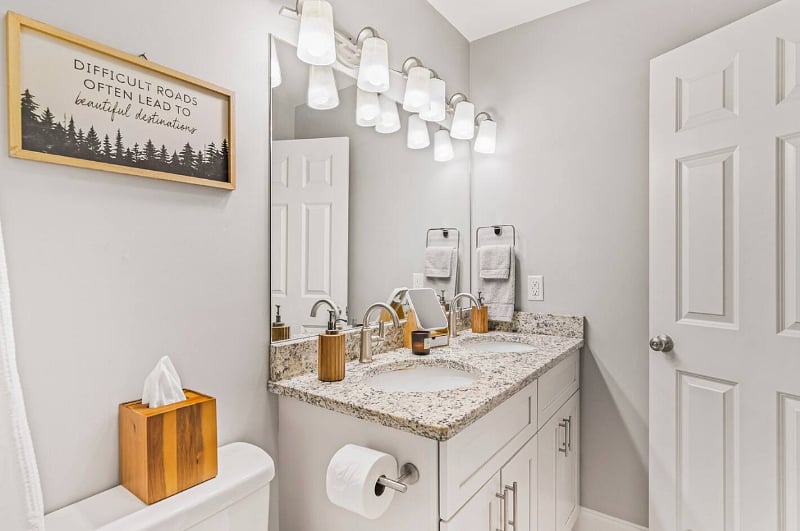 Master Bedroom equipped with 55" Smart TV, large walk in closet, a bathroom with shower, tub and his and her sinks. 