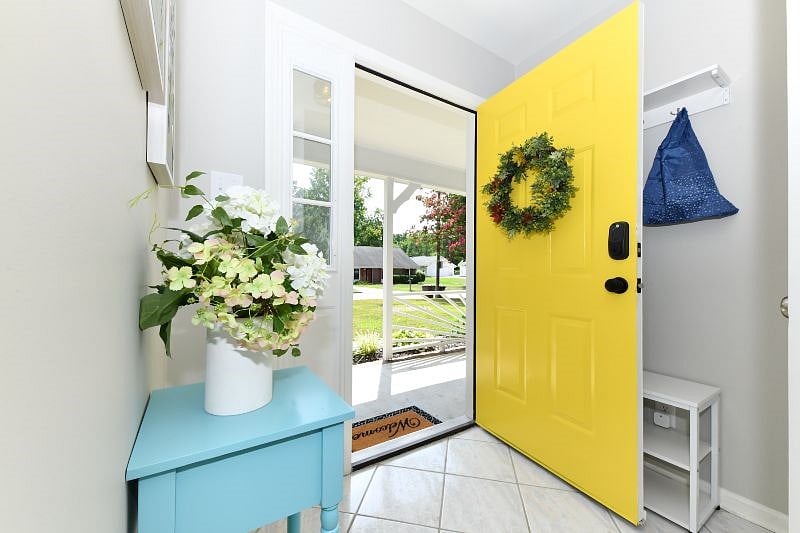 welcoming front door that leads to an open living space