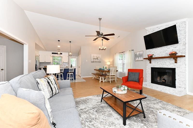 living space opens to dining area and kitchen