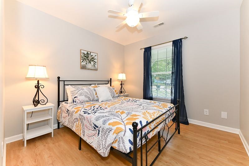 second bedroom with queen size bed, hybrid mattress, side tables and closet