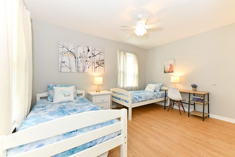 third bedroom with 2 single beds and work space