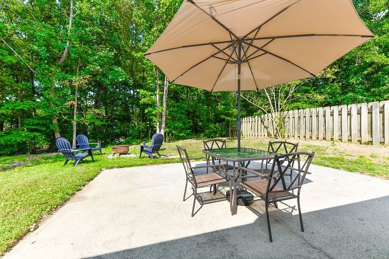 outdoor furnitures: table, chairs, umbrella, Adirondack chairs and fire pit