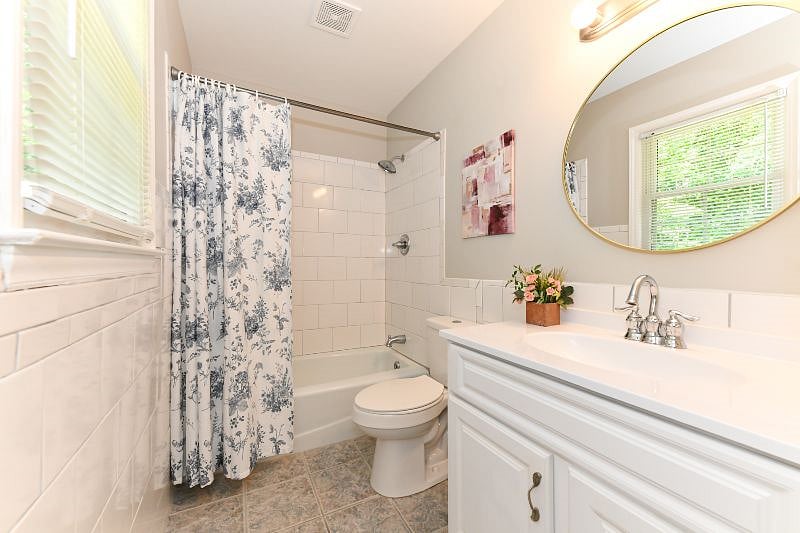 en-suite primary bathroom: hair dryer and start kit of toiletries