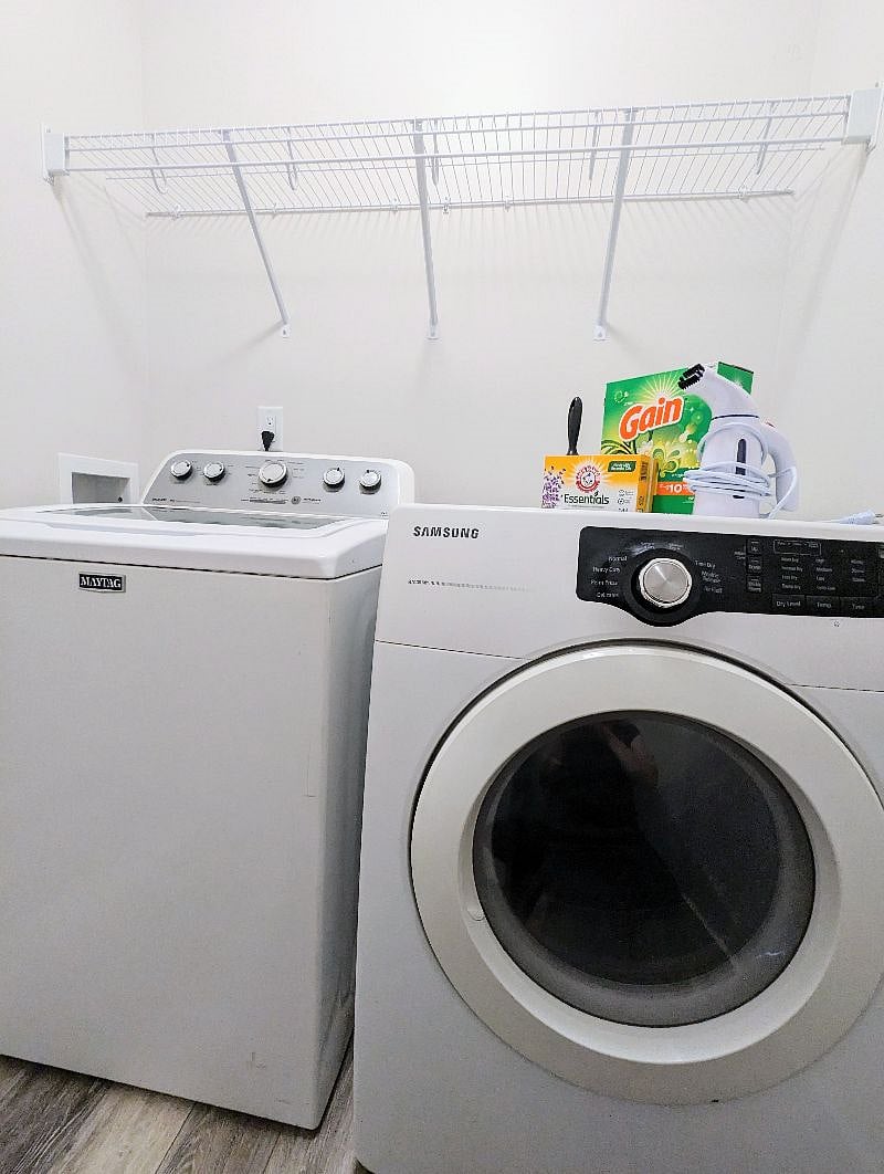 The laundry room features some basic supplies to get you started along with a steamer and a high powered dryer and top-loading washer.