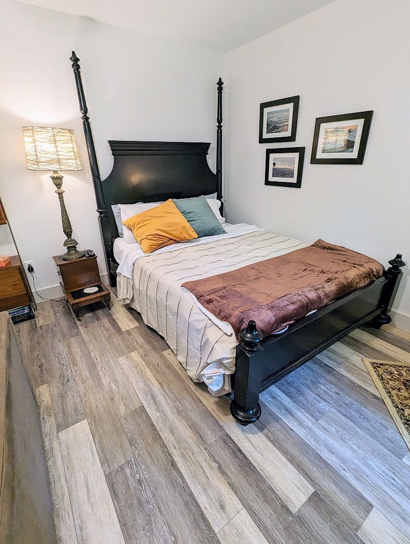 Sleep well in this dramatic, queen-size bed, which features velvety pillows and throw blanket with soft sheets.