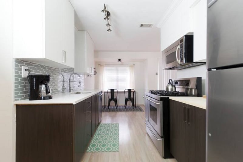 Updated kitchen with 5 burner gas stove, full size fridge, dishwasher, microwave and all dishes/silverware/cooking utensils provided. 