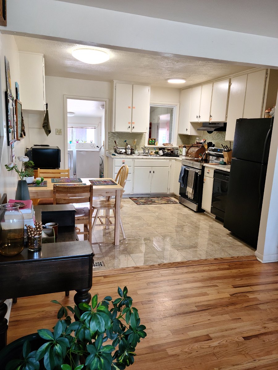 Kitchen has newly purchased electric stove. An additional refrigerator is in the garage so that each unit can accommodate two tenants.