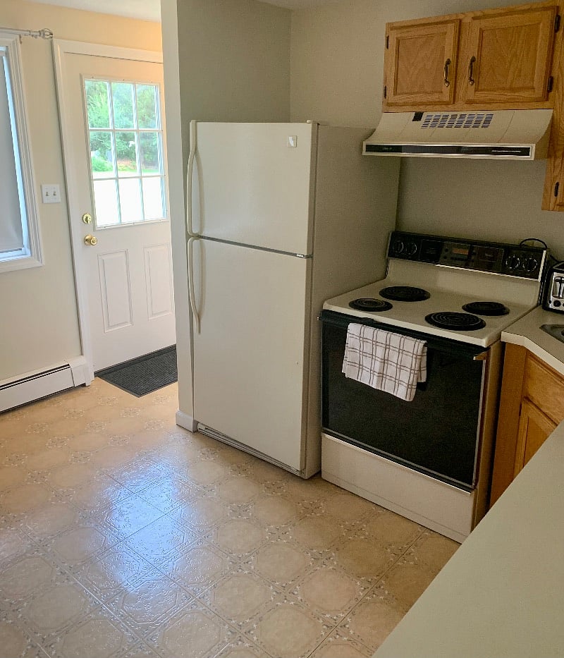 Full size fridge, stove, toaster, and fully stocked with the cooking essentials as well as glasses, dishes and flatware.