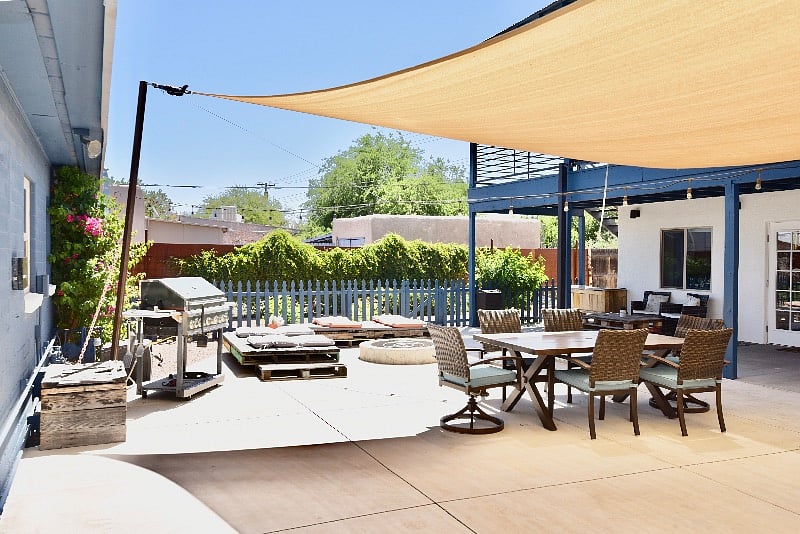 View as you enter from side gate. Beautiful, lush backyard with ample seating, ample areas to sit in the shade and a gas BBQ grill. The unit offers free street parking. This area is shared space. 